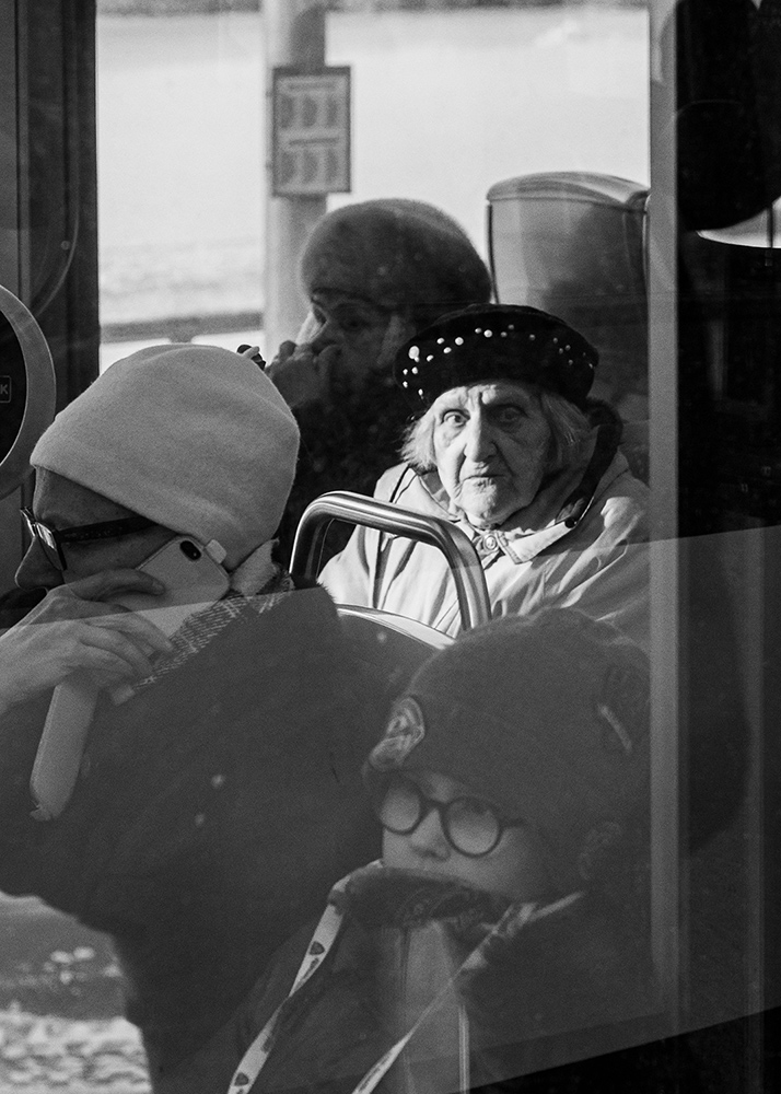 an elderly woman in a tram